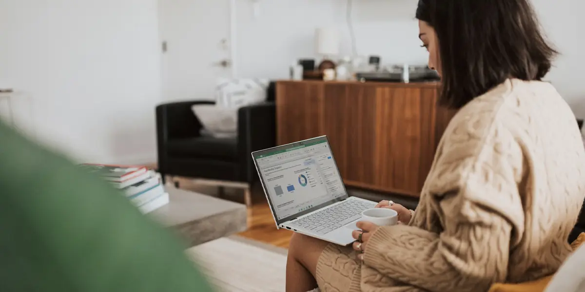 Header image featuring a woman working on a laptop. Image represents the concept that data enhancement has the power to improve the discoverability of objects in the museum CMS