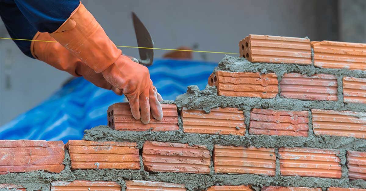A work-in-progress brick wall being built.
