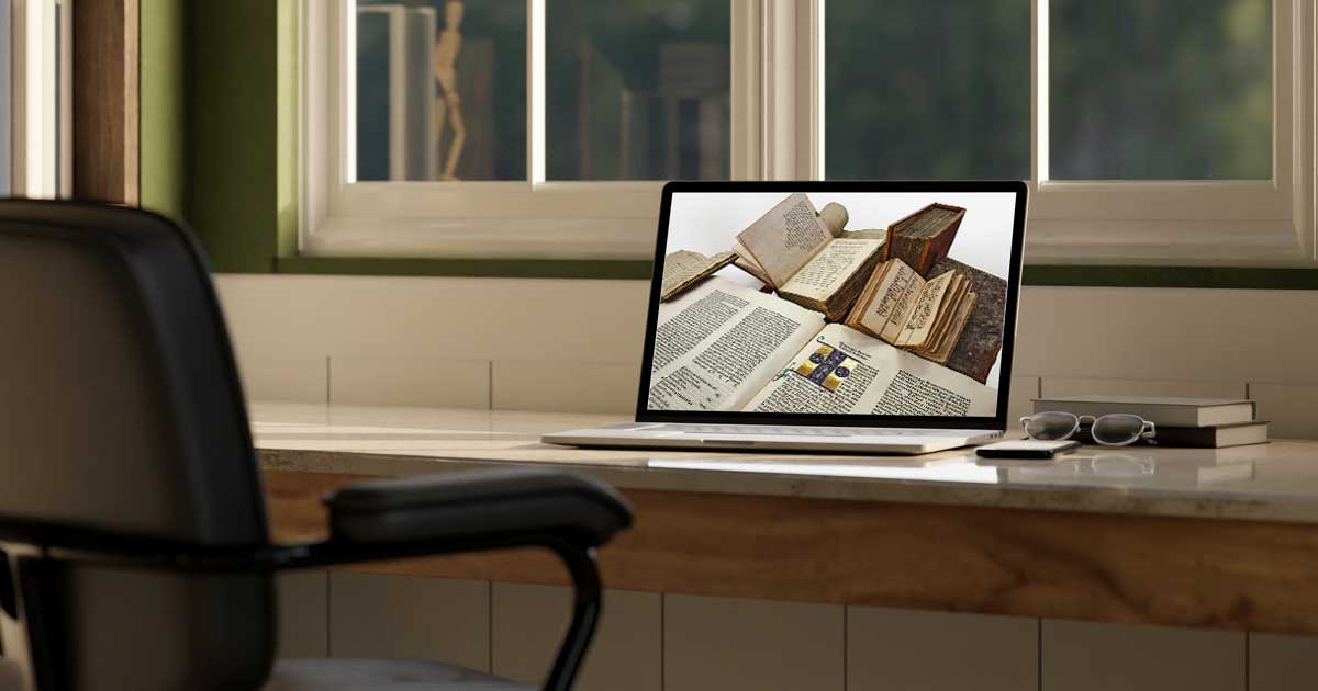 A laptop displaying images of open books.